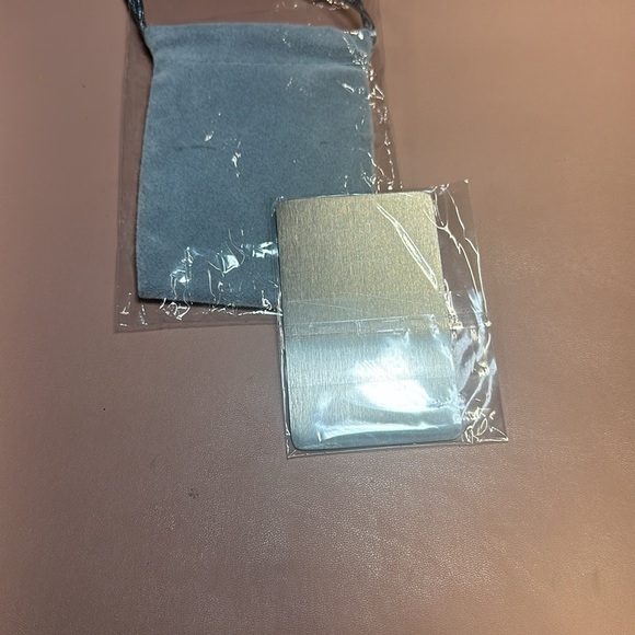 New in package anniversary metal card in a gray cloth pouch - Picture 2 of 5